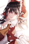  1girl ascot bangs bare_shoulders black_hair bow brown_ascot collared_shirt commentary_request detached_sleeves eyebrows_visible_through_hair eyes_visible_through_hair frills hair_between_eyes hair_ornament hair_tubes hakurei_reimu hand_on_own_face hand_up highres long_sleeves looking_to_the_side medium_hair open_mouth red_bow red_eyes red_skirt red_vest shirt simple_background skirt smile solo standing touhou tsuyuji_shigure vest white_background white_shirt wide_sleeves 