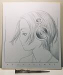  1girl bare_shoulders border closed_mouth english_text floating_hair graphite_(medium) greyscale half-closed_eyes headphones highres jewelry looking_away looking_down looking_to_the_side mechanical_pencil monochrome murata_range necklace original pencil photo_(medium) portrait profile shikishi short_hair solo traditional_media 