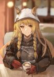  1girl absurdres animal_ears arknights artist_name bangs belt blonde_hair blurry blurry_background braid ceobe_(arknights) ceobe_(unfettered)_(arknights) chain closed_mouth collared_jacket commentary_request cup dog_ears dog_girl ears_through_headwear eyebrows_visible_through_hair gloves highres holding holding_cup indoors jacket long_hair looking_at_viewer milbi orange_eyes oversized_clothes pov_across_table red_gloves sitting smile solo sweater table twin_braids white_headwear 