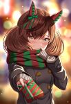  1girl animal_ears bangs black_coat blurry blurry_background box brown_hair coat commentary_request eyebrows_visible_through_hair gift gift_box green_scarf holding holding_gift horse_ears horse_girl long_sleeves looking_at_viewer nice_nature_(umamusume) red_scarf scarf short_hair solo striped striped_scarf umamusume valentine yellow_eyes zukky 