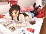  1girl alternate_costume antenna_hair beige_shirt black_legwear blush brown_hair cellphone chocolate cushion denim denim_shorts food highres idolmaster idolmaster_cinderella_girls indoors legwear_under_shorts lli7chi lying on_bed on_stomach pantyhose phone pocky reading red_eyes ringorou_(idolmaster) shirt shorts solo straight_hair striped striped_shirt tsujino_akari 