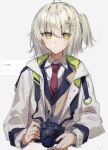  1girl arknights background_text blonde_hair brown_jacket camera camera_around_neck closed_mouth coat collared_shirt expressionless grey_background hair_ornament highres jacket long_sleeves looking_at_viewer mokuro3m necktie one_side_up open_clothes open_coat red_necktie scene_(arknights) shirt short_hair solo translation_request upper_body white_coat white_shirt yellow_eyes 