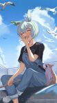  1girl absurdres animal_ears bangs bird black_shirt blurry blurry_foreground blush cat cathy_idx chain-link_fence clouds contrail fence fishing_rod grey_hair hair_ornament hairclip hand_up highres holding holding_fishing_rod horse_ears open_mouth outdoors overalls pants pants_rolled_up seagull seiun_sky_(umamusume) shirt shoes short_hair short_sleeves sitting sneakers solo umamusume yawning 