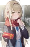  1girl aroa_(aroamoyasi) bangs blonde_hair blurry blurry_background blush chocolate coat gift highres long_hair long_sleeves looking_at_viewer open_clothes open_coat original scarf school_uniform skirt valentine winter_clothes yellow_eyes 
