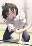  1girl arm_support barefoot blurry blurry_background brown_eyes brown_hair card closed_mouth commentary_request jonsun kneeling misaki_(jonsun) motion_blur one_eye_closed original shirt short_hair short_sleeves solo t-shirt tears twitter_username white_shirt 