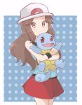  1girl blue_shirt brown_hair chocomiru commentary hat leaf_(pokemon) looking_at_viewer pleated_skirt pokemon pokemon_(creature) pokemon_(game) pokemon_frlg polka_dot polka_dot_background red_skirt shirt skirt sleeveless sleeveless_shirt smile squirtle 