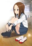  1girl bangs black_legwear blue_sailor_collar blue_skirt brown_eyes brown_hair commentary full_body highres hugging_own_legs indoors karakai_jouzu_no_takagi-san kneehighs long_sleeves looking_away medium_hair nyoro_(nyoronyoro000) on_floor parted_bangs pleated_skirt sailor_collar school_uniform serafuku shirt shoes shoes_removed sitting skirt smile solo takagi-san uwabaki white_shirt wooden_floor 