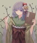  1girl bangs bare_tree blunt_bangs book bug butterfly closed_mouth flower green_kimono hair_flower hair_ornament hakama hieda_no_akyuu highres holding holding_book holding_paintbrush japanese_clothes kimono long_sleeves looking_at_viewer ookashippo outdoors paintbrush purple_hair red_hakama smile solo touhou tree upper_body violet_eyes wide_sleeves 
