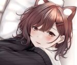  1girl animal_ear_fluff animal_ears bangs blush brown_eyes brown_hair cat_ears cat_girl eyebrows_behind_hair fangs hair_ornament hairclip highres higuchi_madoka idolmaster idolmaster_shiny_colors lips looking_at_viewer medium_hair mole mole_under_eye off_shoulder on_bed parted_lips pillow portrait shirt smile solo swept_bangs white_shirt yuzuyu_(hyui) 