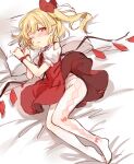  1girl armband bangs blonde_hair blush closed_mouth commentary_request crystal dress eyebrows_visible_through_hair fang flandre_scarlet full_body hair_ribbon highres looking_at_viewer lying medium_hair no_hat no_headwear on_bed on_side one_eye_closed one_side_up pantyhose paragasu_(parags112) pillow puffy_short_sleeves puffy_sleeves red_dress red_eyes red_ribbon ribbon shiny shiny_hair short_sleeves sleepy solo touhou white_legwear wings 