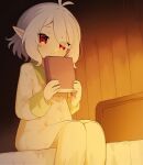  1girl antenna_hair bed blush book commentary_request elf feet_out_of_frame hair_between_eyes highres holding holding_book kokkoro_(princess_connect!) looking_at_viewer nukomota on_bed pajamas pink_eyes pointy_ears princess_connect! short_hair silver_hair sitting smile solo 