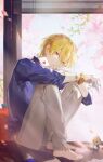  1boy bangs barefoot blonde_hair blue_shirt bracelet card collarbone earrings eyebrows_visible_through_hair fate/grand_order fate_(series) full_body gilgamesh_(caster)_(fate) gilgamesh_(establishment)_(fate) gilgamesh_(fate) highres holding holding_card hugging_own_legs jacket jewelry kk7_000 looking_at_viewer male_focus necklace no_shoes official_alternate_costume red_eyes shirt short_hair sitting smile solo 