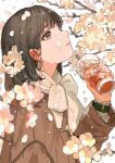  1girl absurdres brown_coat brown_eyes brown_hair cherry_blossoms coat commentary_request cup disposable_cup drink drinking_straw earrings english_text falling_petals from_side hand_up highres holding holding_drink jewelry long_sleeves looking_up medium_hair original parted_lips petals qooo003 scarf simple_background solo spring_(season) upper_body watch watch white_background white_scarf 