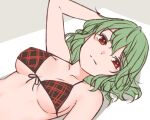  1girl arm_behind_head bangs bare_shoulders bikini breasts collarbone commentary eyebrows_visible_through_hair green_hair hair_between_eyes kazami_yuuka looking_at_viewer lying medium_breasts medium_hair miyo_(ranthath) on_back plaid plaid_bikini red_eyes simple_background solo split_mouth swimsuit touhou upper_body 