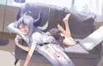  1girl ahoge barefoot black_horns black_shorts braid closed_eyes couch curtains dakimakura_(object) hana_mori hololive horns indoors la+_darknesss long_hair lying multicolored_hair on_couch on_stomach pillow shirt shorts soles solo streaked_hair striped_horns t-shirt tokoyami_towa violet_eyes virtual_youtuber white_shirt window 