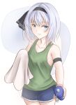  1girl alternate_costume atodasi_s bangs black_armband black_hairband blue_eyes blue_shorts blush bob_cut bottle breasts collarbone commentary_request cowboy_shot eyelashes green_tank_top hairband highres holding holding_bottle holding_towel konpaku_youmu konpaku_youmu_(ghost) looking_at_viewer pink_wristband short_shorts shorts silver_hair simple_background small_breasts smile solo standing tank_top touhou towel white_background 