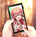  1girl 1other :d =_= ahoge blurry blurry_background blush cellphone cellphone_picture depth_of_field gloves hand_focus highres idol idolmaster idolmaster_shiny_colors komiya_kaho phone phone_screen redhead shiny shiny_hair smile sunyack upper_body w white_gloves 