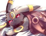  :3 animal_focus blurry blush bokeh closed_mouth commentary_request depth_of_field happy looking_at_viewer lying mochopaccho no_humans on_stomach pokemon pokemon_(creature) red_eyes simple_background slit_pupils smile solo umbreon under_covers upper_body white_background 