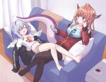  2girls amane_kanata angel angel_wings bangs barefoot black_jacket black_legwear blue_hair blue_shirt blush bow cellphone couch crossed_legs dragon_girl dragon_horns dragon_tail eyebrows_visible_through_hair feathered_wings highres hitsuji_nata holding holding_phone hololive horn_bow horn_ornament horns indoors jacket kiryu_coco long_hair long_sleeves multicolored_hair multiple_girls navel phone pillow pointy_ears red_jacket shirt short_shorts shorts silver_hair sitting sleeping smartphone streaked_hair tail thigh-highs virtual_youtuber white_shirt wings 