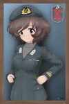  1girl absurdres acrux akiyama_yukari alternate_costume artist_logo bangs beret border brown_border brown_eyes brown_hair closed_mouth commentary dated emblem english_commentary eyebrows_visible_through_hair girls_und_panzer green_headwear green_jacket grey_shirt hat highres insignia jacket long_sleeves looking_at_viewer messy_hair military military_hat military_uniform shirt short_hair smile solo standing twitter_username uniform upper_body 