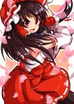 1girl bangs black_hair bow detached_sleeves hair_bow hair_tubes hakurei_reimu highres looking_at_viewer medium_hair nioti nontraditional_miko open_mouth petals red_bow red_eyes red_skirt ribbon-trimmed_skirt ribbon-trimmed_sleeves ribbon_trim skirt solo touhou wide_sleeves 