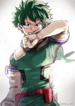  1boy backlighting belt bodysuit boku_no_hero_academia clenched_hand freckles gloves green_bodysuit green_eyes green_hair highres hood hood_down looking_at_viewer male_focus mask mask_removed midoriya_izuku nakamu_405 red_belt solo teeth twitter_username v-shaped_eyebrows white_background white_gloves 