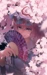  1girl :q arm_under_breasts bangs black_ribbon blue_headwear blue_kimono center_frills cherry_blossoms commentary folding_fan frilled_shirt_collar frills goshoguruma hair_between_eyes hand_fan hand_up hat highres holding holding_fan japanese_clothes kimono licking_lips light_purple_eyes looking_at_viewer mob_cap monosenbei neck_ribbon pink_eyes pink_hair ribbon ribbon-trimmed_collar ribbon_trim saigyouji_yuyuko saigyouji_yuyuko&#039;s_fan_design shippou_(pattern) short_hair solo tongue tongue_out touhou triangular_headpiece upper_body wide_sleeves 