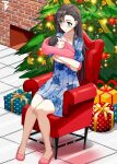  1boy 1girl arizona_(azur_lane) armchair azur_lane baby blue_dress blush brown_hair chair child christmas_ornaments christmas_tree closed_mouth commander_cool commission crossed_arms dress fireplace full_body gift green_eyes highres knees_together_feet_apart legs mother_and_son sitting sleeping slippers smile swaddled 