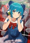  1girl bangs blue_bow blue_dress blue_eyes blue_hair blush bow cirno dress eyebrows_visible_through_hair food hair_bow highres holding holding_food ice ice_wings kurowa_(curowa) outdoors puffy_short_sleeves puffy_sleeves red_bow shirt short_hair short_sleeves solo touhou wavy_mouth white_shirt wings 