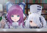  2girls absurdres animal_ears antenna_hair azur_lane blue_eyes book bookshelf coat double_bun fake_animal_ears fur_coat glass_writing hair_ornament hair_over_one_eye hat highres indoors kiev_(azur_lane) lamp long_hair multiple_girls one_eye_covered open_mouth purple_hair red_eyes smile soar_sora222 tashkent_(azur_lane) twintails white_coat white_hair window 