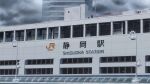  building city cityscape clouds cloudy_sky commentary_request grey_sky highres isbeyvan japan lamppost no_humans original outdoors rain scenery shizuoka_prefecture sky train_station window 