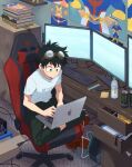  1boy akiyama_(noconoco) all_might bangs boku_no_hero_academia book book_stack bottle box can cardboard_box chair computer desk energy_drink freckles gaming_chair goggles goggles_on_head green_eyes green_hair highres indian_style laptop logo midoriya_izuku poster_(object) product_placement short_hair sitting solo water_bottle 
