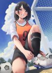  1girl absurdres anemone_noa ball bangs black_hair black_legwear black_shorts blue_eyes blush breasts clouds day full_body goal grin highres kneehighs large_breasts looking_away medium_hair number_print one_knee orange_vest original outdoors shirt shoes short_sleeves shorts smile soccer_ball solo vest white_footwear white_shirt 