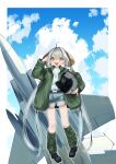  1girl absurdres aircraft airplane ao_(greburi) belt black_belt black_footwear blonde_hair boots border brown_hair clouds denim denim_shorts fighter_jet green_jacket grey_hair headwear_removed helmet helmet_removed highres holding holding_helmet jacket jet jewelry long_hair military military_vehicle multicolored_hair necklace original outside_border salute shorts sky smile solo streaked_hair tube_socks very_long_hair white_border 