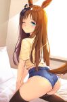  1girl ;) animal_ears ass backlighting black_legwear bloody0rabby blue_shorts blush brown_hair closed_mouth commentary_request grass_wonder_(umamusume) highres horse_ears horse_girl horse_tail indoors long_hair looking_at_viewer looking_back on_bed one_eye_closed pillow shirt short_shorts short_sleeves shorts smile solo sunlight sweat tail thigh-highs umamusume very_long_hair window yellow_shirt 