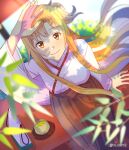  1girl arm_up asuna_(sao) bangs blonde_hair blurry blurry_background blurry_foreground breasts brown_eyes closed_mouth day floating_hair from_above hakama highres japanese_clothes kimono long_hair long_sleeves looking_at_viewer medium_breasts miko outdoors red_hakama smile solo sword_art_online tu_tora2 twitter_username very_long_hair white_kimono wide_sleeves 