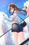  1girl ass bag bangs black_hair black_shorts blue_sky building cellphone clouds commentary day denim denim_shorts eyebrows_visible_through_hair floating_hair from_behind from_below green_eyes hair_between_eyes highres holding holding_phone idolmaster idolmaster_cinderella_girls idolmaster_cinderella_girls_starlight_stage long_hair long_sleeves looking_at_viewer looking_back looking_down outdoors phone ribbed_shirt shibuya_rin shirt short_shorts shorts shoulder_bag sky solo sutoroa very_long_hair white_shirt 