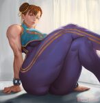  1girl arm_support artist_name bangs bare_shoulders blue_unitard bracelet breasts brown_eyes brown_hair chun-li closed_mouth commentary crossed_legs curtains double_bun fingernails gold_trim jewelry large_breasts lips looking_at_viewer muscular muscular_female rejean_dubois shadow simple_background sitting skin_tight sleeveless smile solo street_fighter street_fighter_zero_(series) unitard 