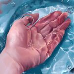  1other bubble caustics commentary_request hand_focus open_hand original partially_submerged solo sunlight water yasuta_kaii32i 