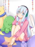  1girl absurdres atsuki_(pink0930cat) bangs bare_legs barefoot bed blue_eyes blush bow collarbone eromanga_sensei frills grey_hair hair_bow hand_on_headphones hand_on_own_foot headboard headphones highres izumi_sagiri knees_to_chest long_hair long_sleeves looking_to_the_side low_tied_hair on_bed pajamas shorts sitting solo stuffed_animal stuffed_bunny stuffed_octopus stuffed_toy sweat teddy_bear v-shaped_eyebrows very_long_hair 