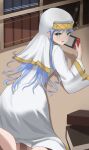  1girl absurdres bangs blue_hair dress eyebrows_visible_through_hair green_eyes highres index_(toaru_majutsu_no_index) indoors long_hair long_sleeves looking_at_viewer looking_back lying nintendo_switch nun on_stomach open_mouth solo toaru_majutsu_no_index ttusee5 veil very_long_hair white_dress 