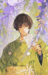  1boy black_hair brown_hair closed_mouth day flower giving green_kimono hand_up holding holding_paper ishikirimaru japanese_clothes kimono light_particles logo looking_at_viewer male_focus mirror_aurora_0 nature obi paper sash smile solo touken_ranbu upper_body violet_eyes web_address wisteria 