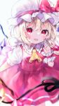  1girl ascot bangs blonde_hair blurry bow crystal depth_of_field eyebrows_visible_through_hair fang flandre_scarlet hat hat_bow heart heart-shaped_pupils highres holding laevatein_(touhou) looking_at_viewer mob_cap pafe_yuzuran red_bow red_eyes red_skirt red_vest shirt short_sleeves simple_background skirt solo symbol-shaped_pupils touhou vest white_background white_headwear white_shirt wings wrist_cuffs yellow_ascot 