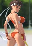  1girl adjusting_buruma adjusting_clothes ass bangs bare_shoulders blurry blurry_background breasts brown_eyes buruma closed_mouth commentary_request covered_nipples day from_behind gloves gym_uniform headband highres holding kasugano_sakura kyakkun lips medium_breasts midriff shiny shiny_hair short_hair simple_background smile street_fighter street_fighter_zero_(series) sweat sweatdrop thighs 