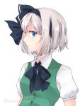  1girl artist_name bangs black_bow black_bowtie black_hairband black_ribbon blue_eyes bow bowtie breasts buttons closed_mouth collared_shirt commentary_request dress eyebrows_visible_through_hair green_dress grey_hair hair_between_eyes hairband konpaku_youmu looking_at_viewer medium_breasts puffy_short_sleeves puffy_sleeves ribbon shirt short_hair short_sleeves simple_background solanikieru solo touhou upper_body white_background white_shirt 