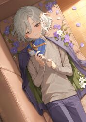  1boy box dungeon_meshi flower heart-shaped_box highres lazy_eye lying male_focus mayomayoland mithrun on_back otoko_no_ko pants solo turtleneck 