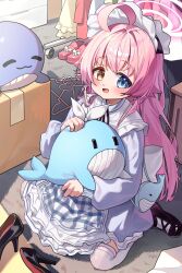  1girl :d absurdres ahoge alternate_costume apron black_shoes blue_archive blue_dress blue_eyes blush capry commentary dress from_above full-body_tattoo hair_flaps hair_intakes halo heterochromia highres hoshino_(blue_archive) huge_ahoge indoors inflatable_toy inflatable_whale long_hair long_sleeves looking_at_viewer maid_headdress open_mouth orange_eyes pink_hair pink_halo shoes sidelocks sitting smile solo stuffed_whale symbol-only_commentary tattoo thigh-highs unworn_clothes unworn_shoe very_long_hair white_thighhighs 