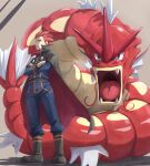  1boy alternate_color belt boots cape closed_mouth commentary_request crossed_arms frown gyarados highres itsudzumi jacket lance_(pokemon) long_sleeves male_focus pants pokemon pokemon_(game) pokemon_hgss redhead shiny_pokemon short_hair spiky_hair standing 