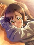  1girl absurdres bespectacled blush brown_hair closed_mouth glasses grey_shirt hair_in_mouth head_rest highres isami_don kunikida_hanamaru love_live! love_live!_sunshine!! medium_hair round_eyewear shirt solo yellow_eyes 