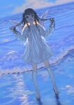  1girl barefoot black_hair blue_sky clouds cloudy_sky dress full_body highres long_hair long_sleeves looking_at_viewer ocean open_mouth original sky solo water waves white_dress wings 